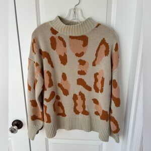 Pink, orange and white sweater